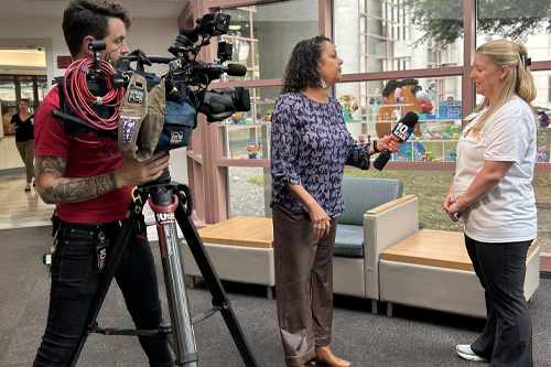 Barbara Morse doing an on-site interview