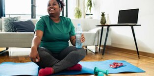 Women smiling after stretching at home