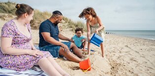group of people sitting on the beach