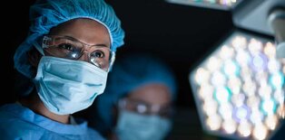 Female surgeon with medical mask