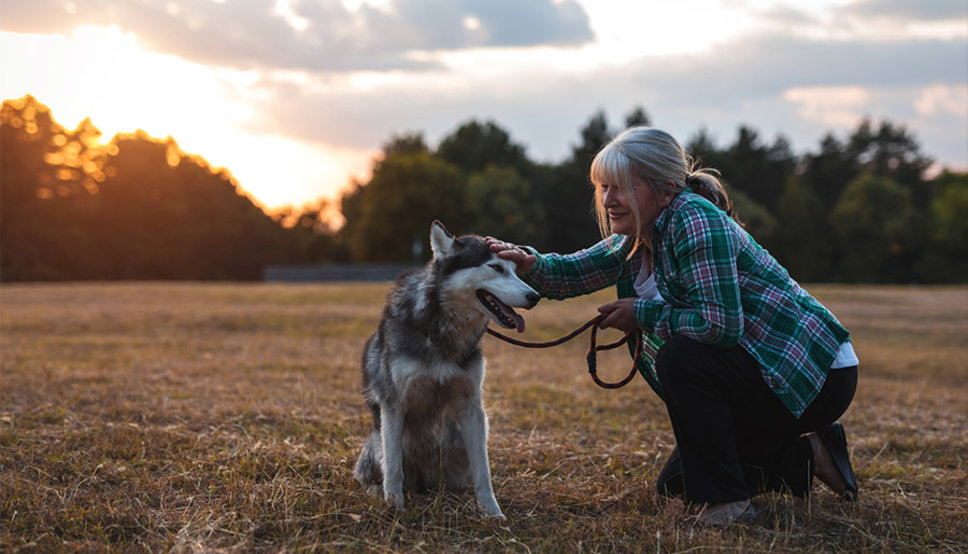 Happy older woman with dog