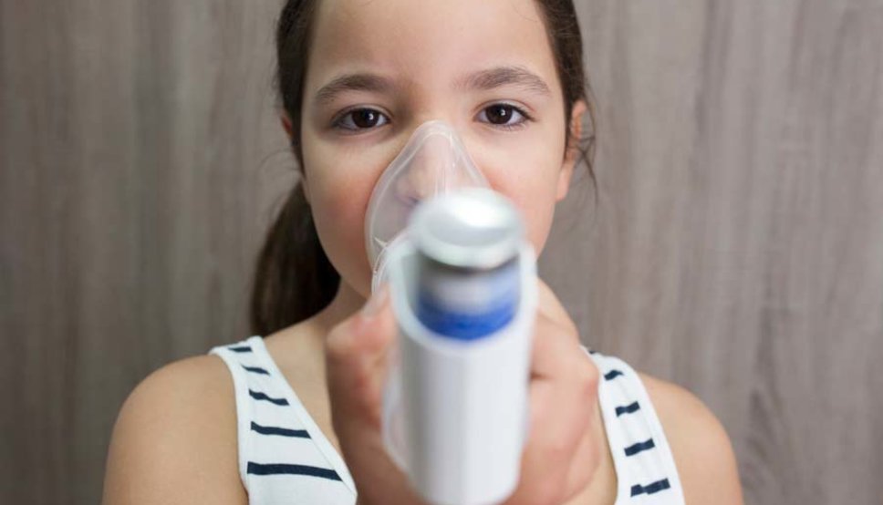 Child with asthma inhaler
