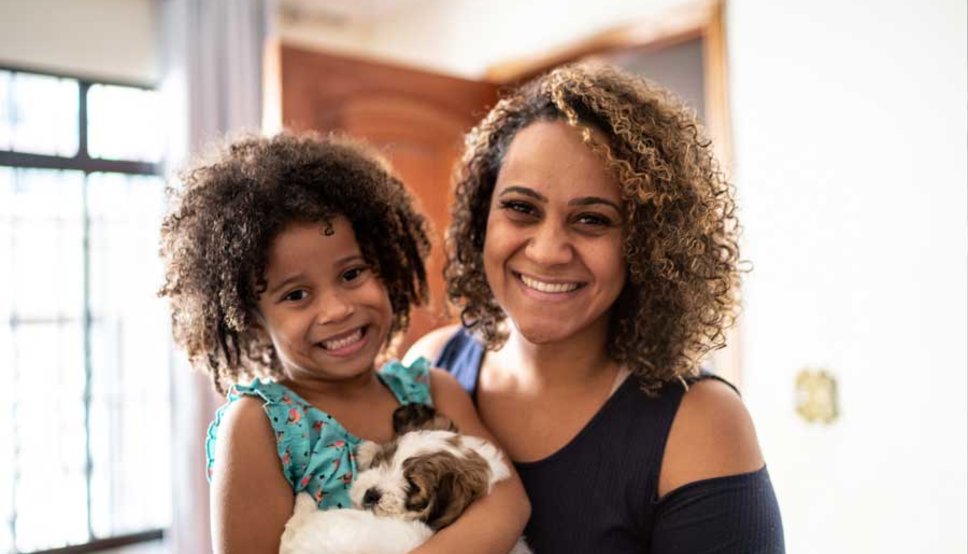 Mother and daughter smiling