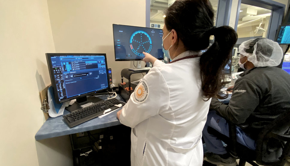 Estelle Torbey, MD, electrophysiologist/cardiologist at the Lifespan Cardiovascular Institute, views activity on the Volta XV1 monitor.