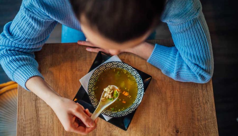 Women eating chicken soup