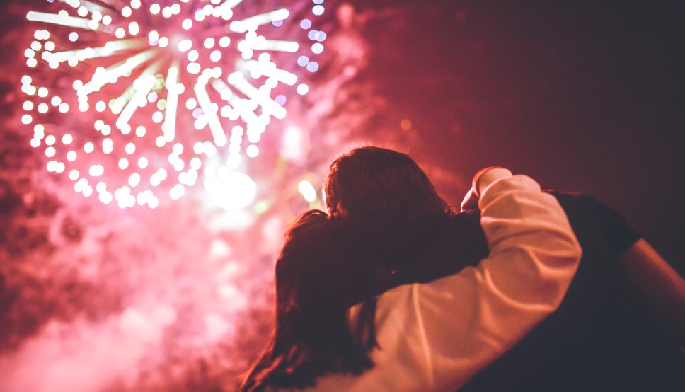 two people watching a professional firework display