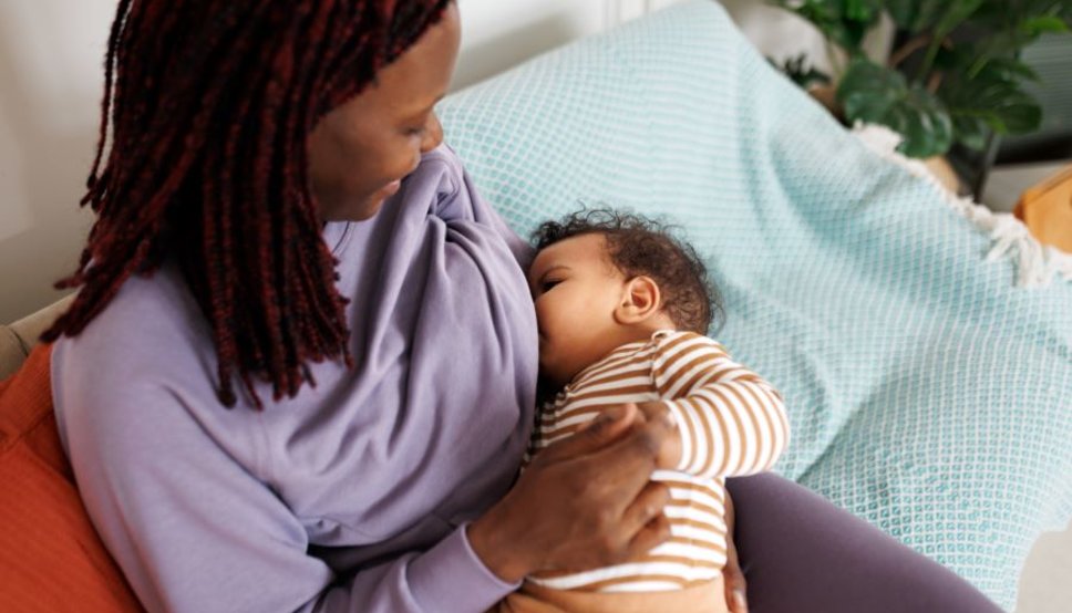 woman breastfeeding her infant
