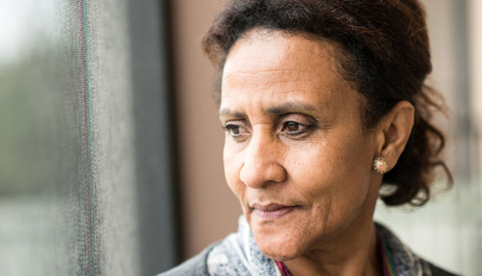 sad woman looking out window