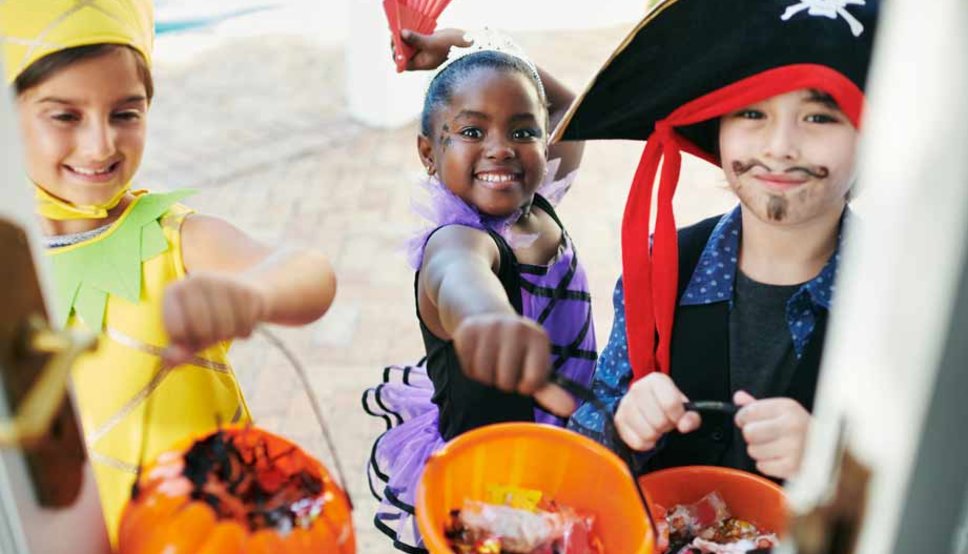 Happy kids trick or treating