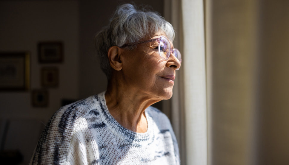 woman looking out window