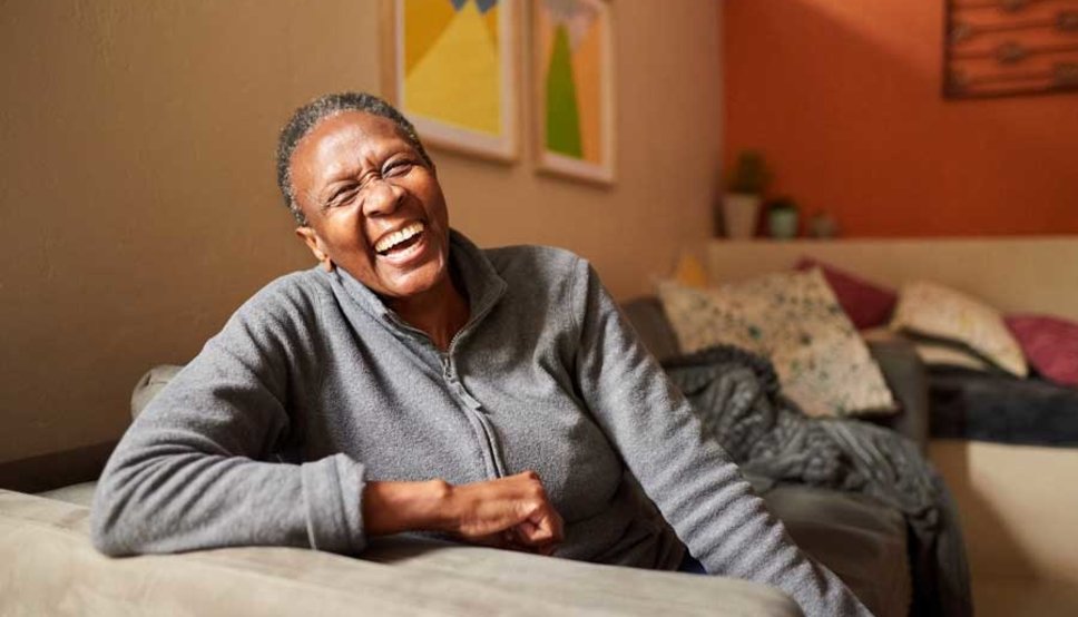 Women laughing on couch