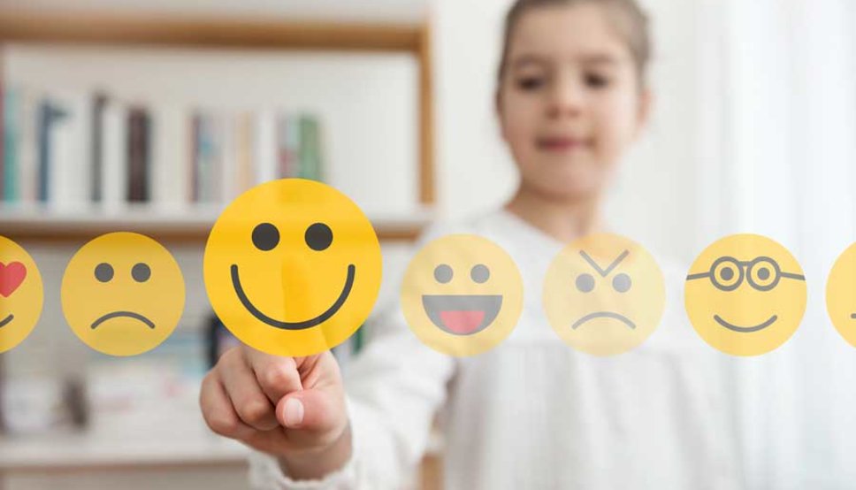 Girl pressing emoji icons super imposed over image