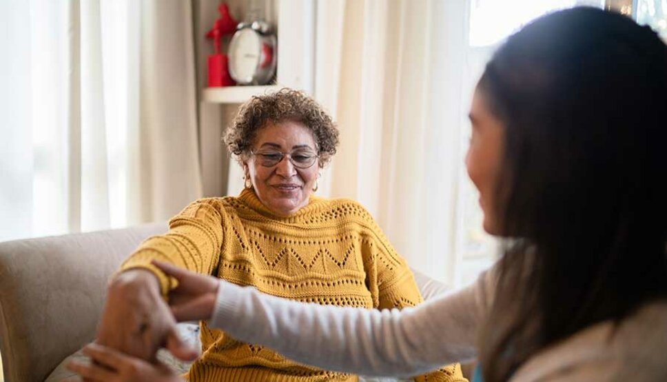 Women with physical therapist at home