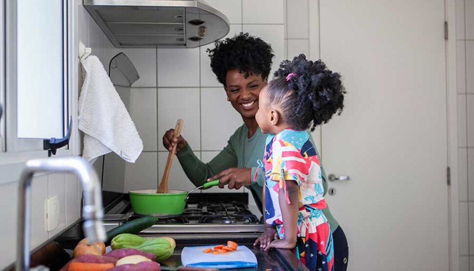 Mother cooking with daughter