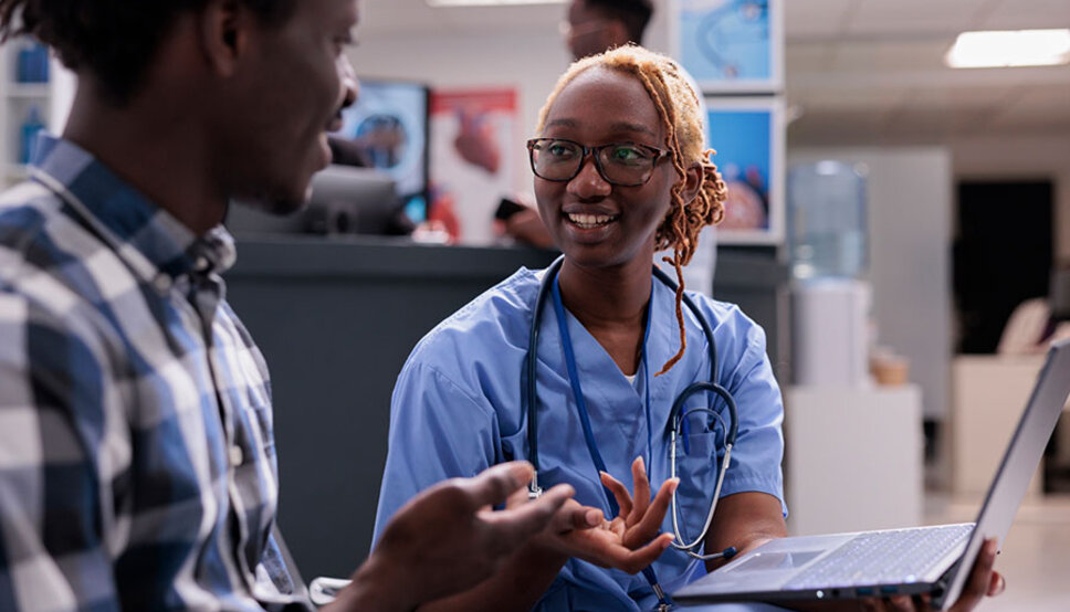 APP talking with patient in healthcare setting