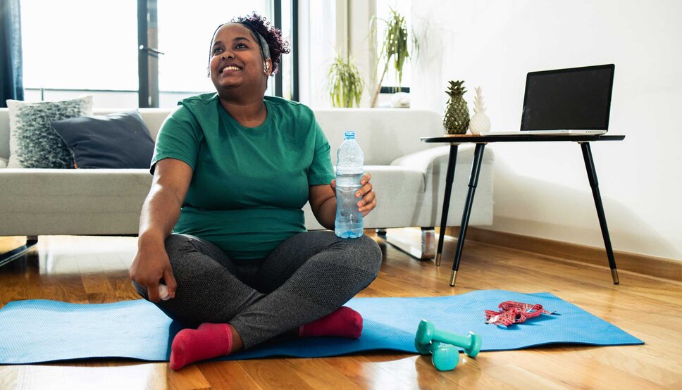 Women smiling after stretching at home