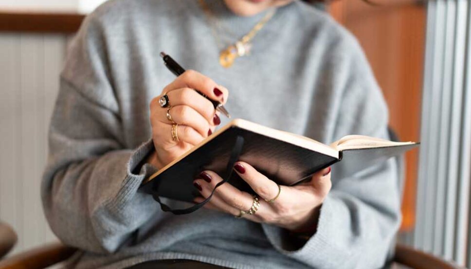 Women writing in notebook