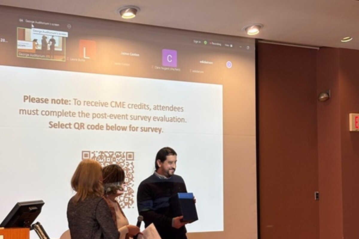 Award recipient holding award