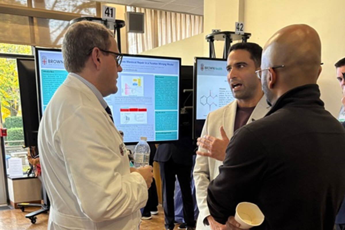 Dr. Monaghan speaking with attendees