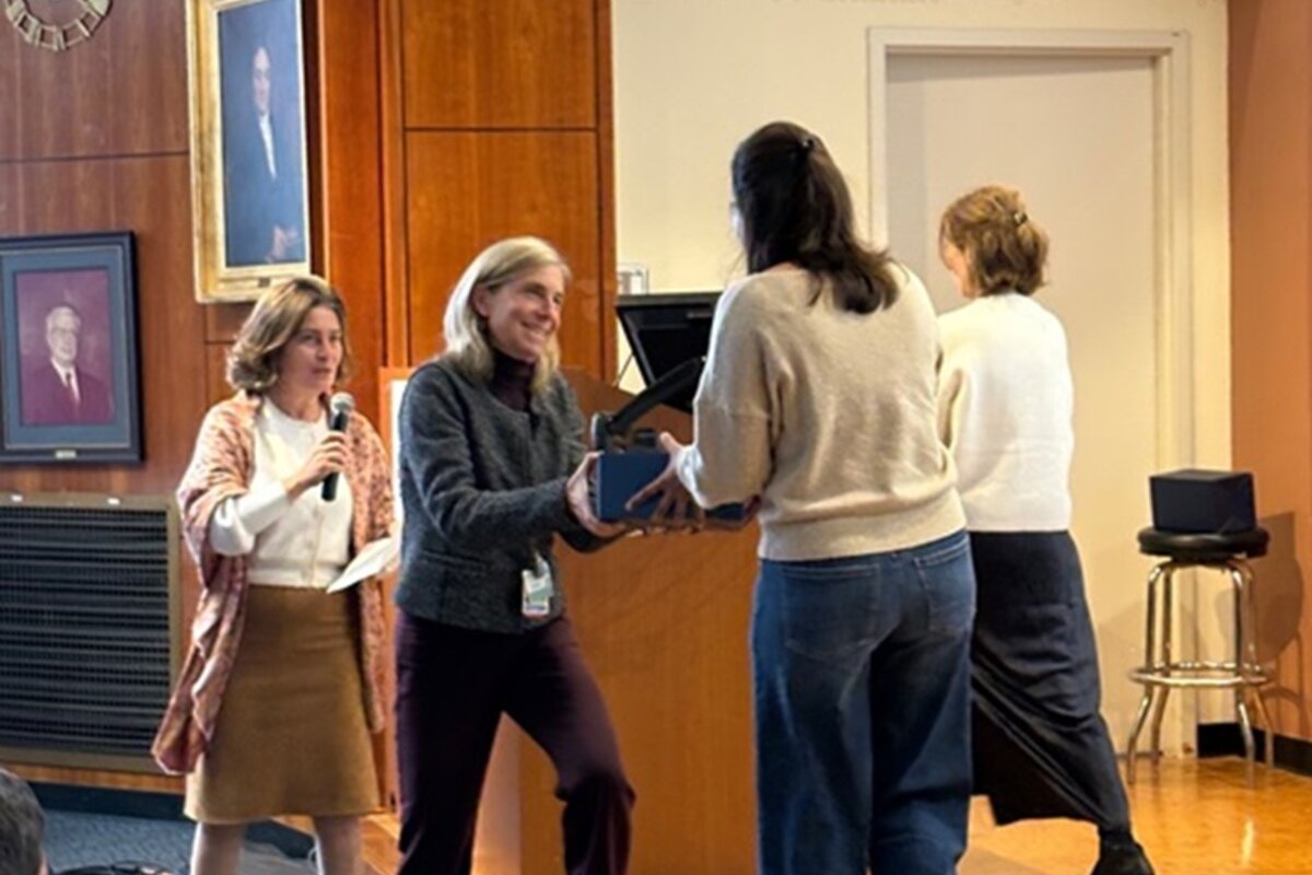 Host stepping on stage to award recipient