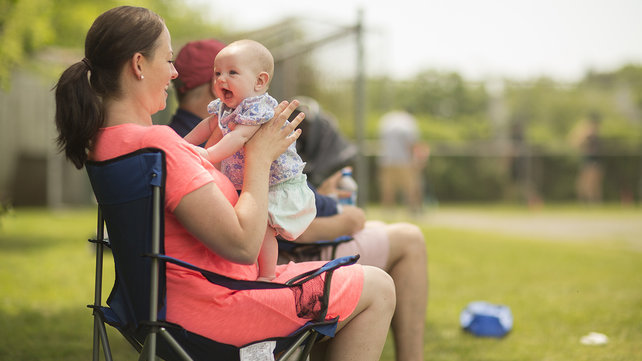 Chase holds her baby.