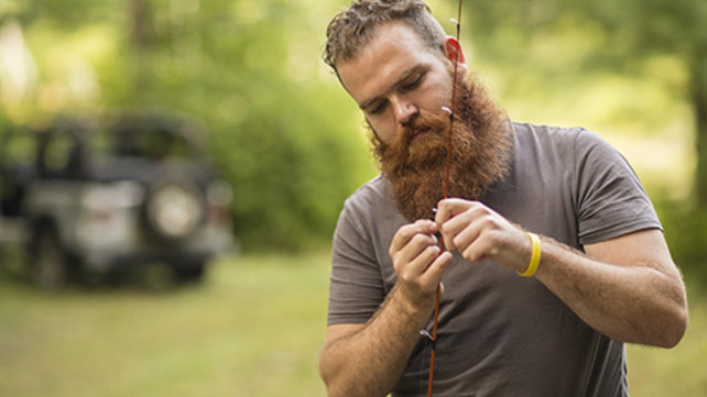 Rob threading a fishing line