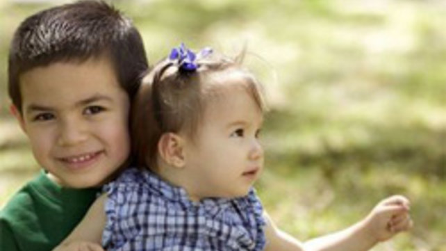 Child in Brother's Lap