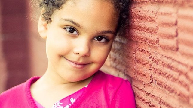 Girl wearing a pink sweater