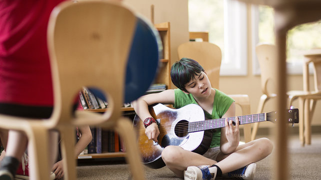Lucky playing guitar