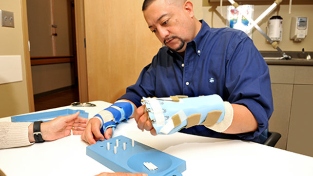 Patient receiving rehabilitation services for hand injuries 