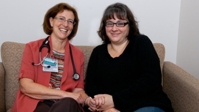 Two women sitting on a couch
