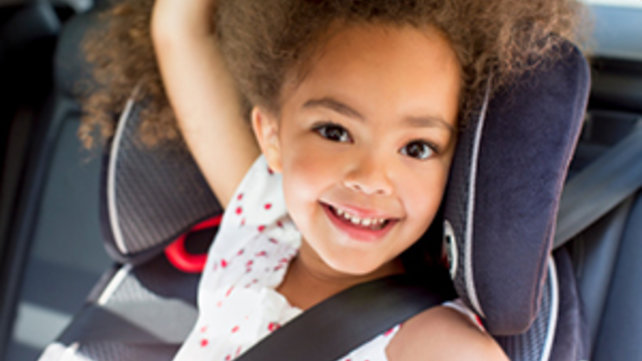 girl sitting in car seat