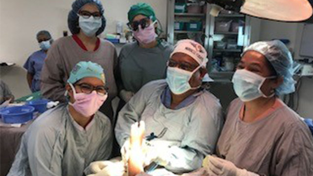 Dr. Katarincic with her team in the operating room.