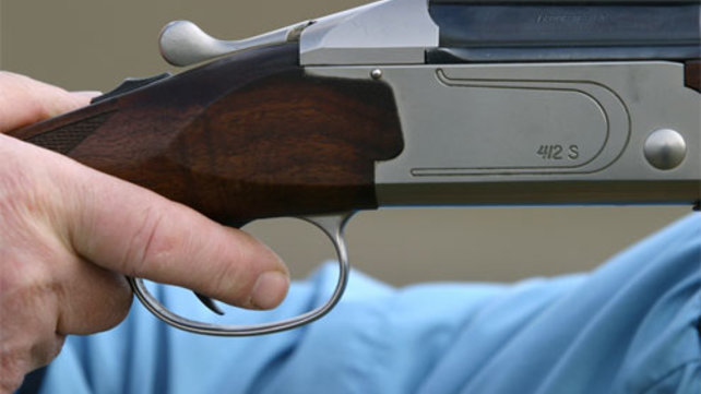 firearm with closeup of trigger