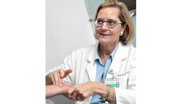 Julia Katarincic, MD with a patient.