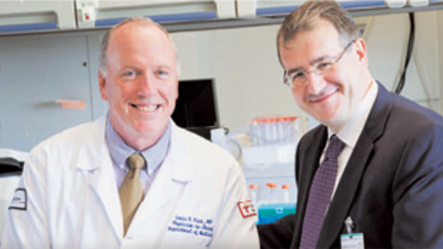 Doctors Mylonakis and Rice smiling at camera