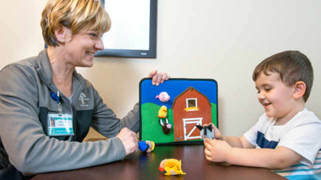 Woman working with a child