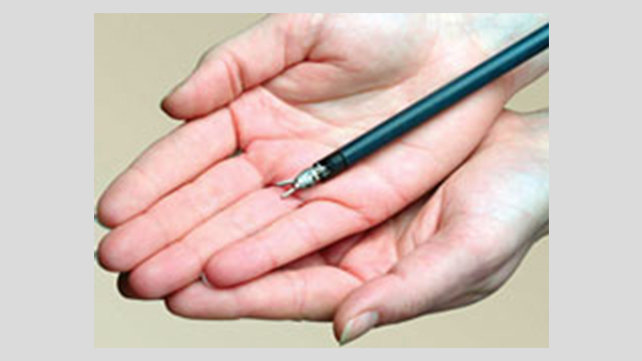 Hands holding a surgical tool