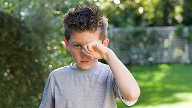 Child rubbing their eye
