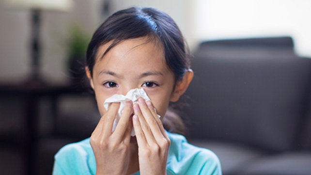 Child blowing their nose
