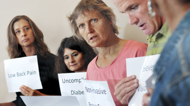 group of adults holding signs
