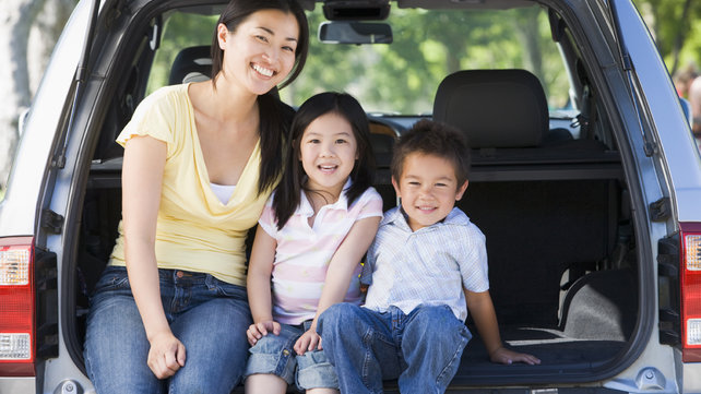 Mom and children outside of car