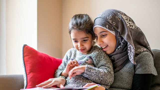 mother reading with daughter