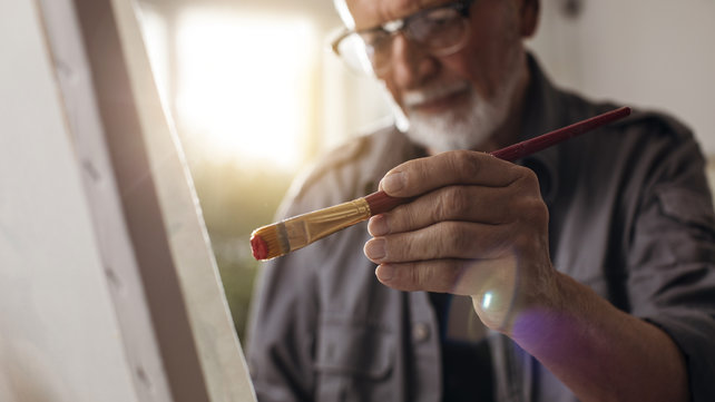 older man painting
