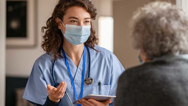 Primary care physician talking to patient