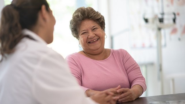 Older adult being seen by a doctor