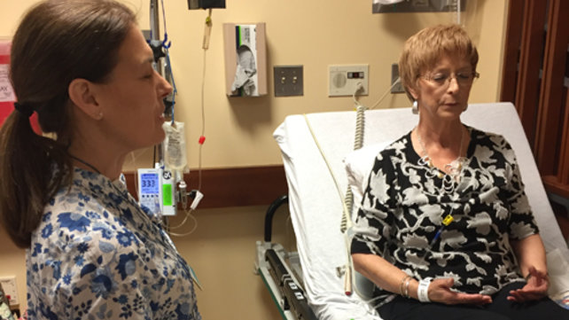Two women meditate during the HeArt Song program.