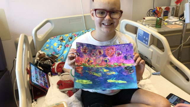 A patient displays her artwork.