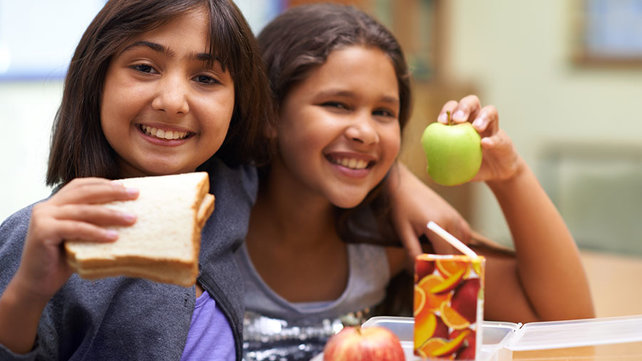Children eating lunch in a school cafeteria