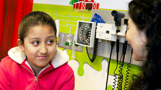 A child talks with an adult.